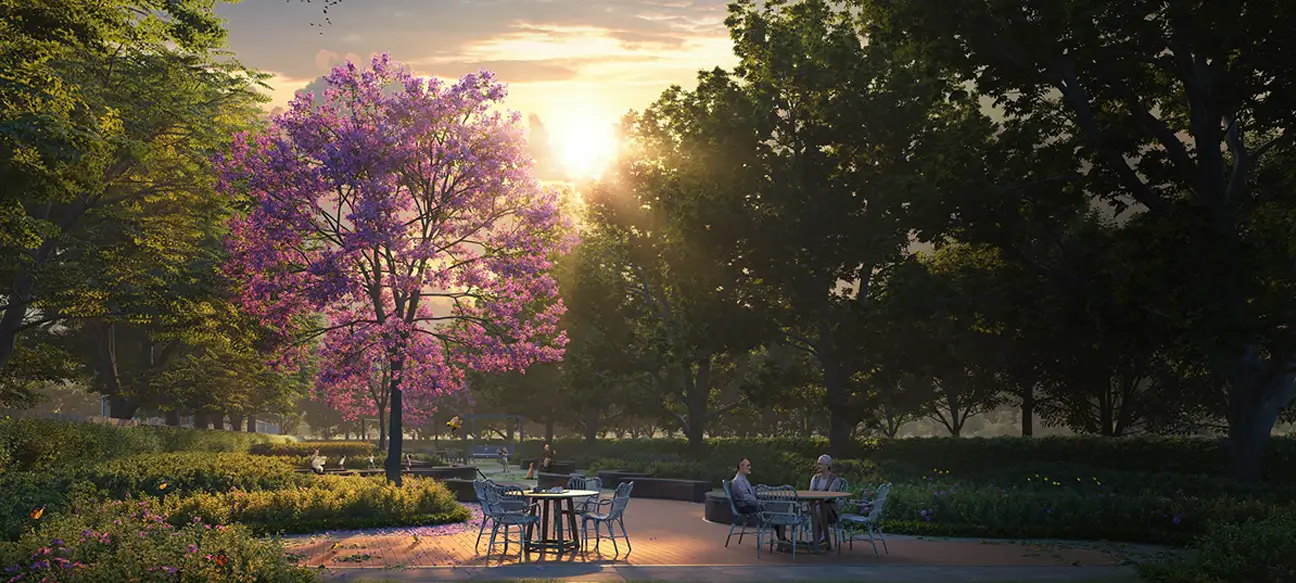 Landscaped garden with seating under flowering trees at Great Value Ekanam