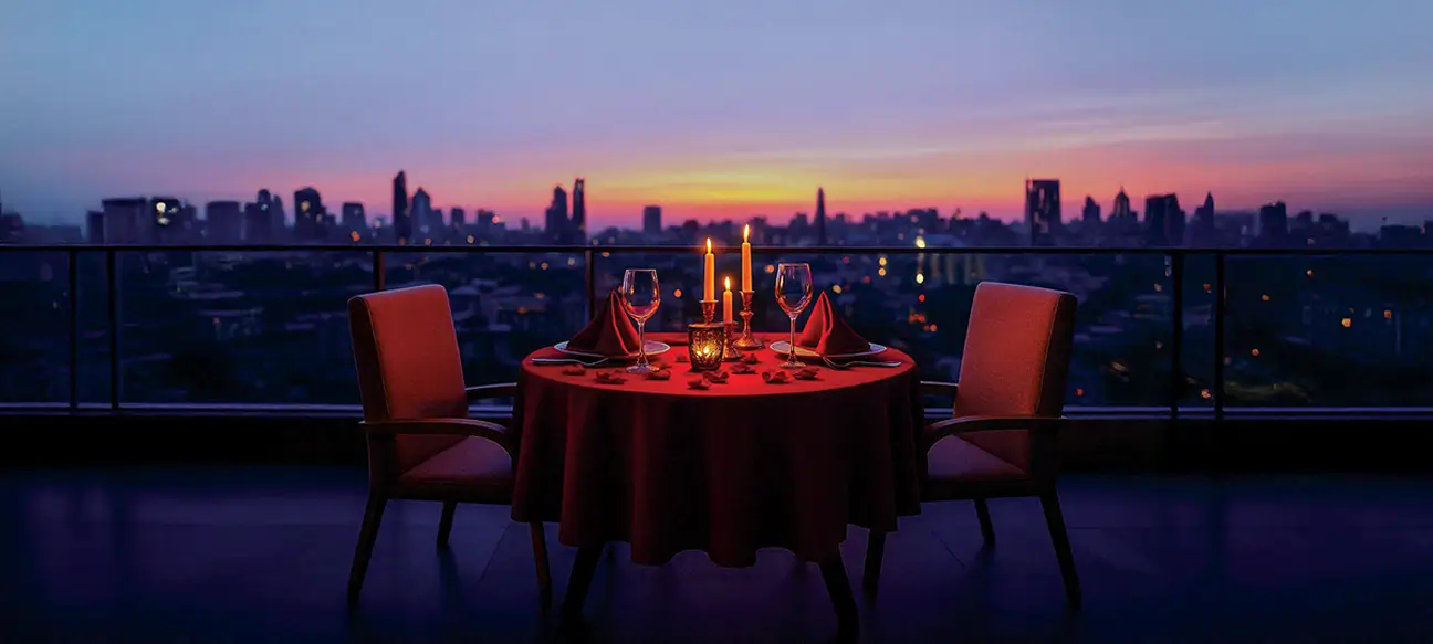Candlelit dinner table overlooking a city skyline (representative stock image, as used in the Ekanam brochure)